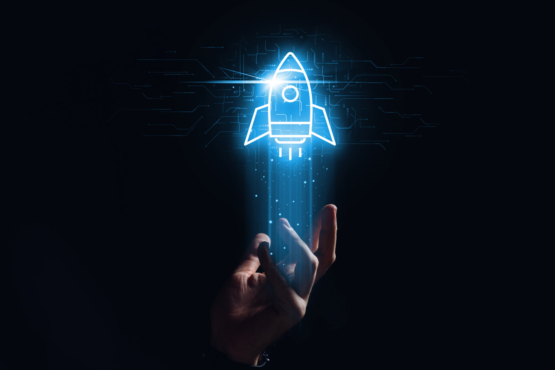 Rocket hologram above hand symbolising digital transformation